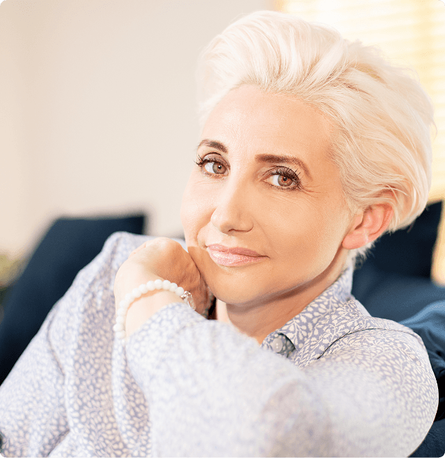 Middle-aged woman smiling.
