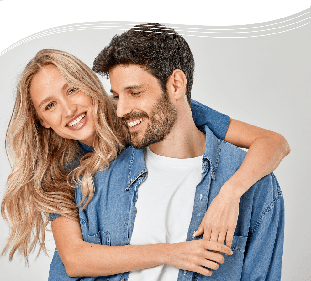 folix-hero-bg-mobile A woman with beautiful hair hugging a man while smiling.